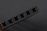 Angled shot of Stackable Header - 6 Pin (Extended) held in hand for PCB prototyping